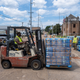 A member of the National Guard delivers palettes of water on a fork-lift at the State Fair Grounds in Jackson, Mississippi, on September 2, 2022